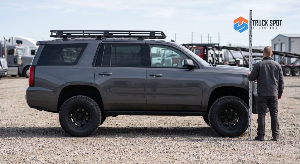 TSL How Much Does It Cost to Ship an SUV or Truck (2) A modified American SUV with a lift kit and roof rack requiring specialized auto transport handling.